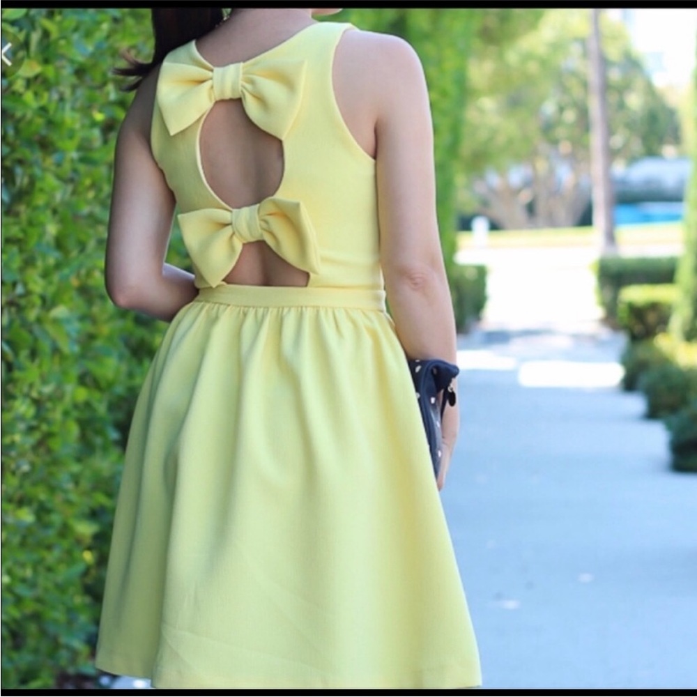Girly yellow dress with adorable bows in open back